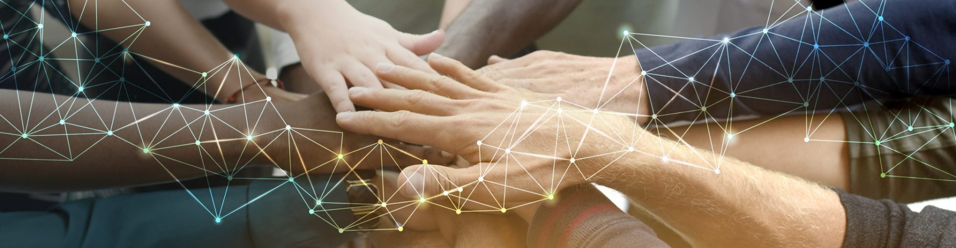 Diverse team joining their hands